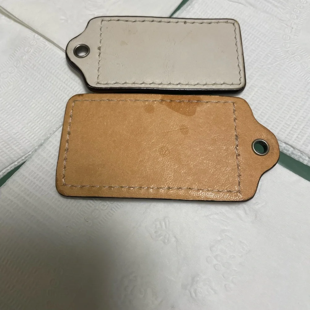 Coach Cream and Tan Leather Keychain Duo tag bag charms 2pc set